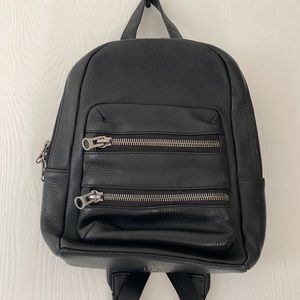 Status anxiety leather mini backpacks
